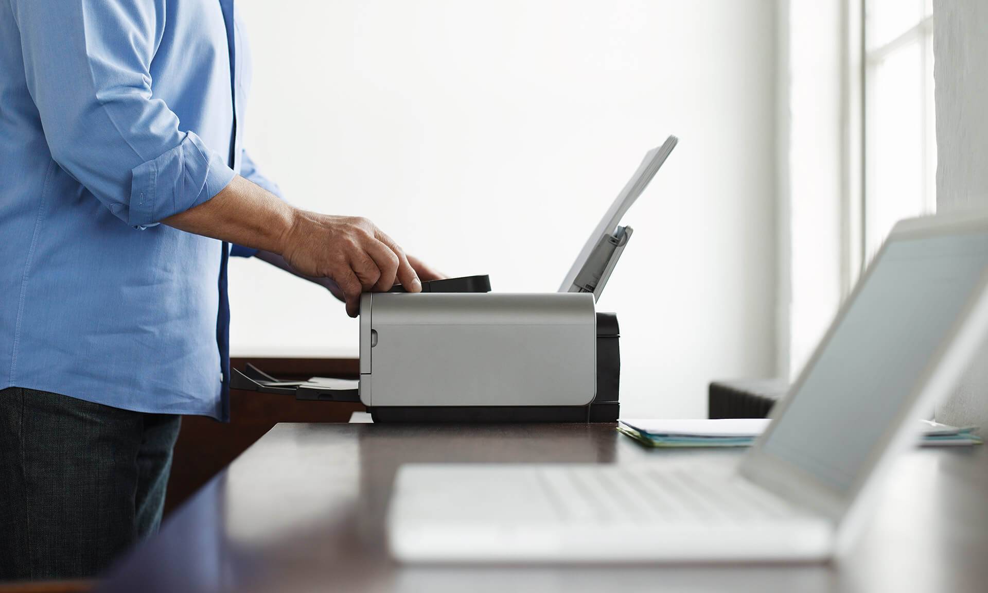worker visiting the office printer